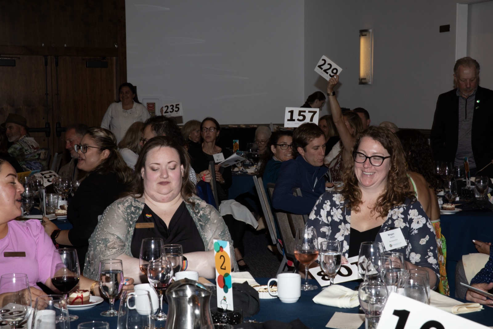 Bid paddles in the air during the live auction