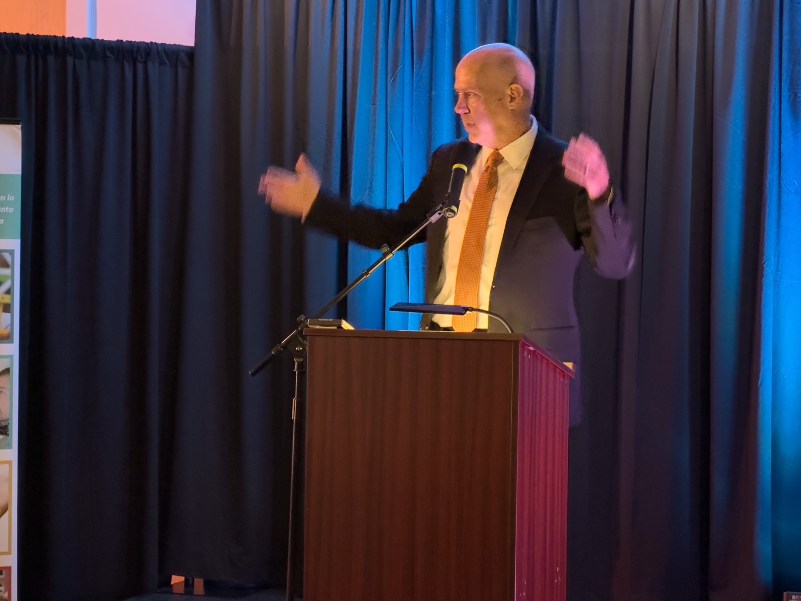 The emcee addressing the room