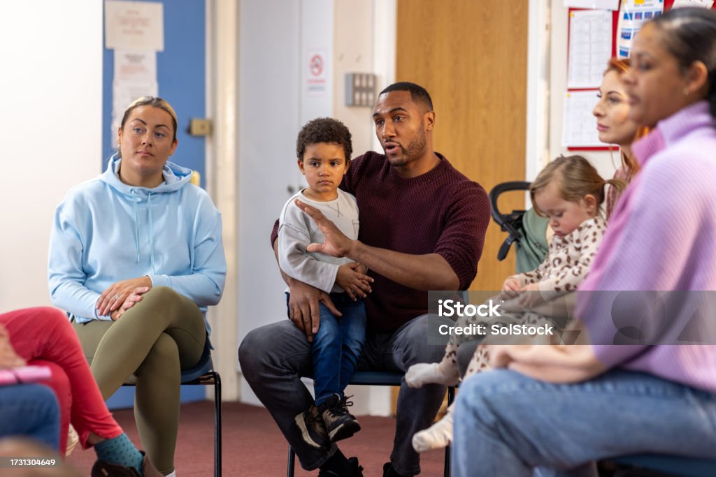 Parents and young children together in a community group session